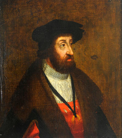 Profile portrait of a man with a beard and black hat looking to the right of the painting. He is wearing a brown cloak and white and red shirt 
