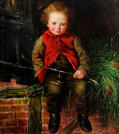 A young boy sitting on a brick wall. He is smiling and wearing a red waistcoat, brown trousers and black boots.
