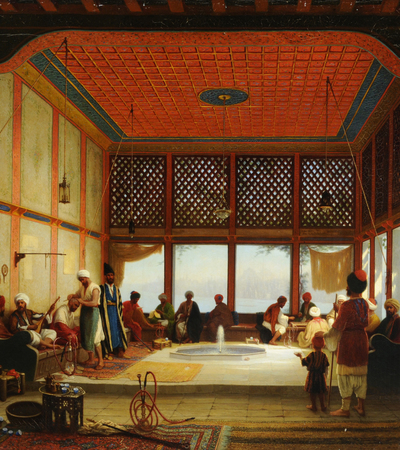 Oil painting of an interior scene, the architecture is Middle Eastern or North African in style. There are numerous people (mostly men) enjoying their leisure time including having refreshments, playing instruments and playing games